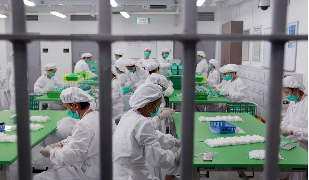Inmates at the Lo Wu female correctional institution spend part of their day at a mask workshop, in this photo taken during a media tour in 2010. Compulsory haircuts for women behind bars might provoke “unimaginable consequences”, a source said. Photo: K. Y. Cheng