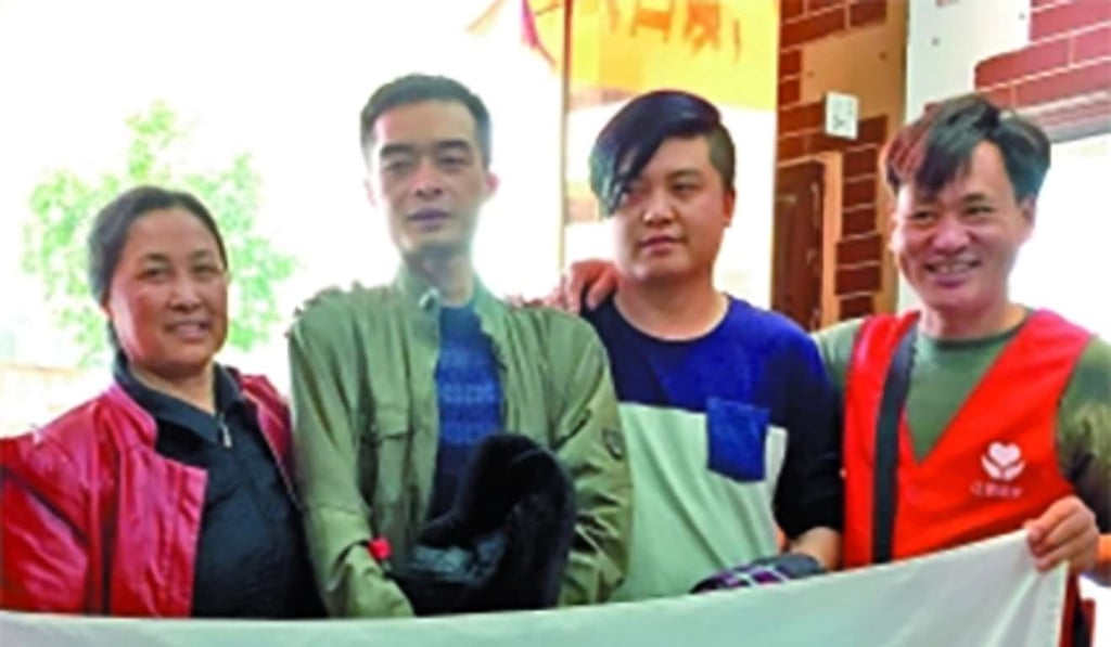 Zhang Huanying (left) with Wang Rong (second left), Wang’s younger brother (second right), and an NGO volunteer on Monday after the family was reunited. Photo: Handout Zhang Huanying (left) with Wang Rong (second left), Wang’s younger brother (second right), and an NGO volunteer on Monday after the family was reunited. Photo: Handout