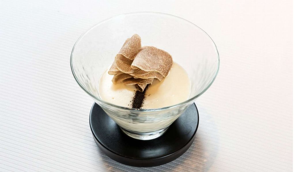 Potatoes cream – a quail egg marinated in lapsang souchong tea and topped with white truffle. Potatoes cream – a quail egg marinated in lapsang souchong tea and topped with white truffle.