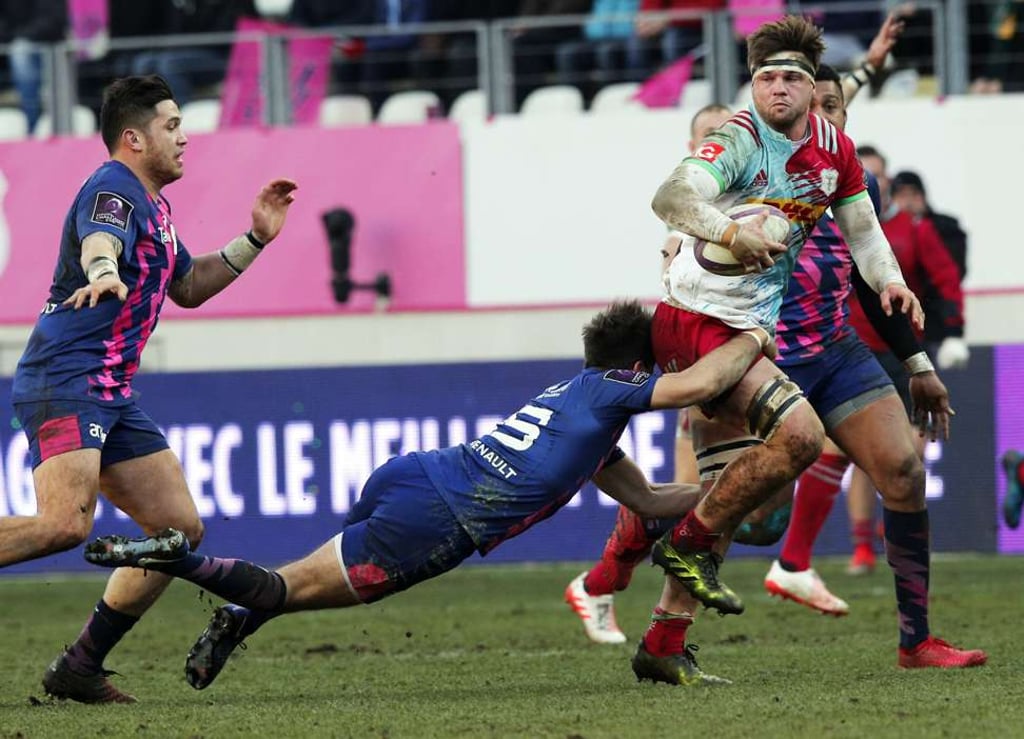 Stade Francais' Hugo Bonneval tackles Harlequins' Jack Clifford. Photo: EPA