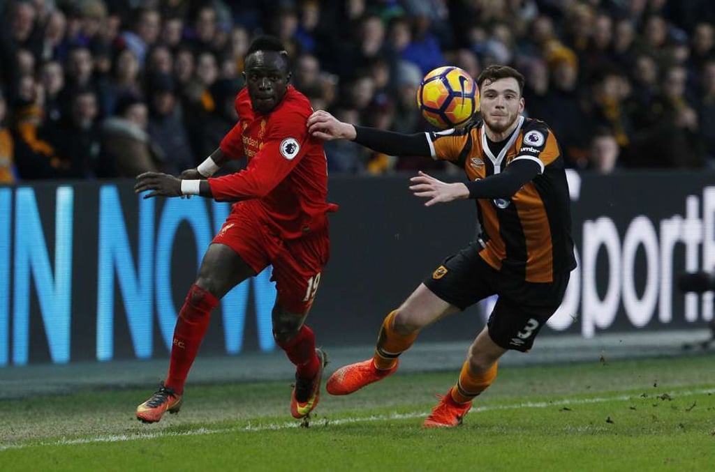 Liverpool's Sadio Mane in action with Hull City's Andrew Robertson. Photo: Reuters