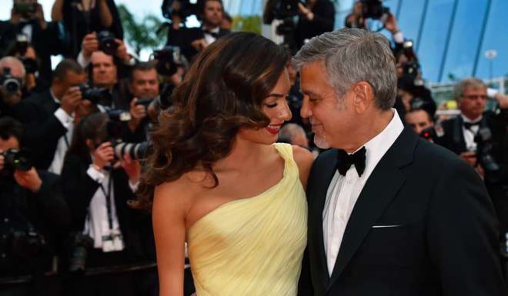 George and Amal Clooney at the 69th Cannes Film Festival on May 12, 2016. Photo: AFP