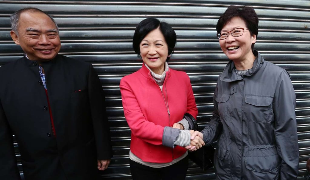 Regina Ip and Carrie Lam shake hands after running into each other following Lam’s meeting with Election Committee members from the agricultural and fisheries sector, in Aberdeen on January 30. Photo: Jonathan Wong