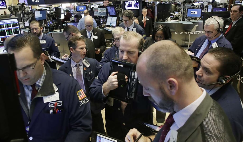 Stock traders follow market activity at the New York Stock Exchange. Photo: AP