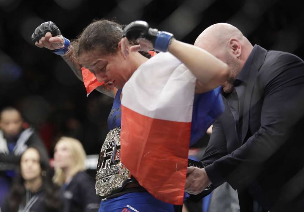 Germaine de Randamie, reacts as the championship belt is placed on her. Photo: AP Germaine de Randamie, reacts as the championship belt is placed on her. Photo: AP