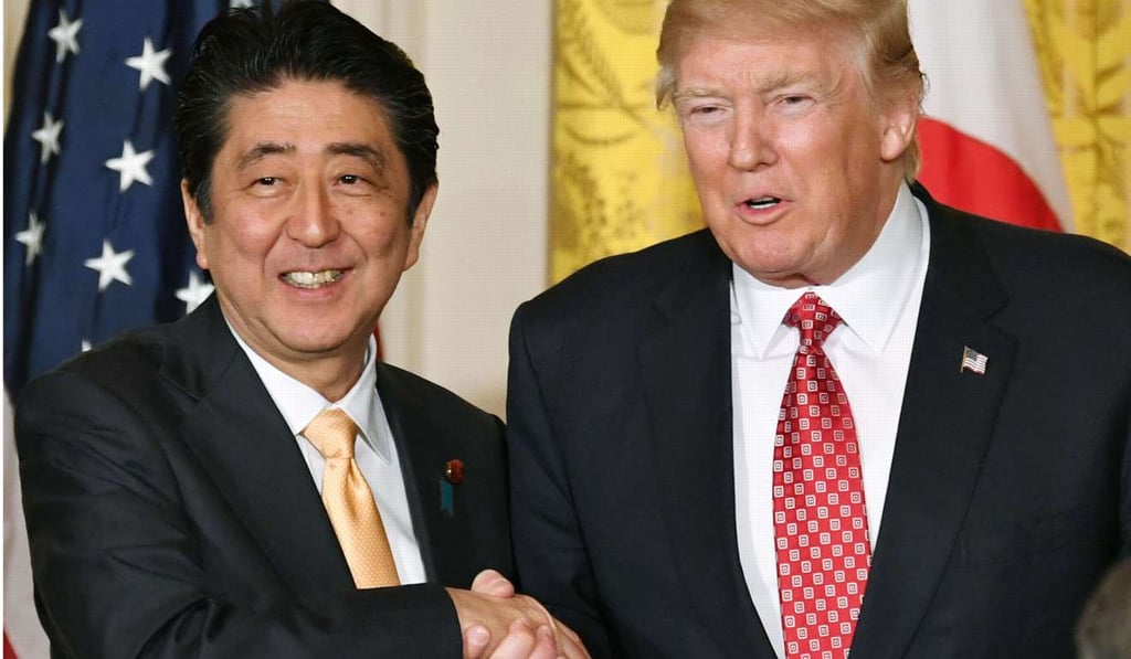 Japanese Prime Minister Shinzo Abe and US President Donald Trump shake hands after a joint press conference at the White House in Washington on Feb 10. Photo: Kyodo