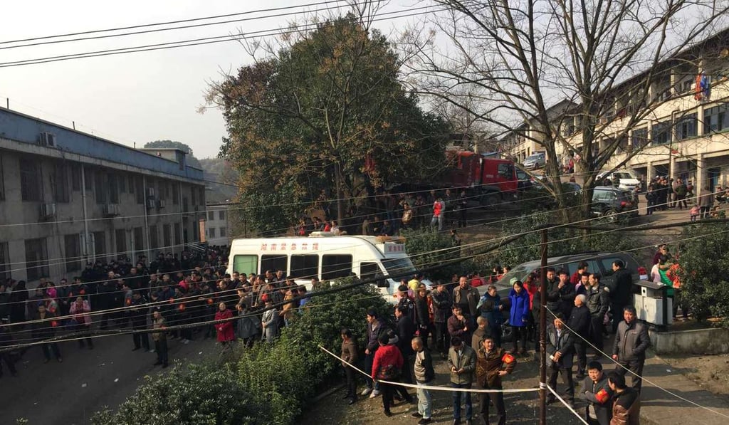 People wait outside the coal mine blast site in Lianyuan, Hunan province, on February 14. Photo: Xinhua People wait outside the coal mine blast site in Lianyuan, Hunan province, on February 14. Photo: Xinhua