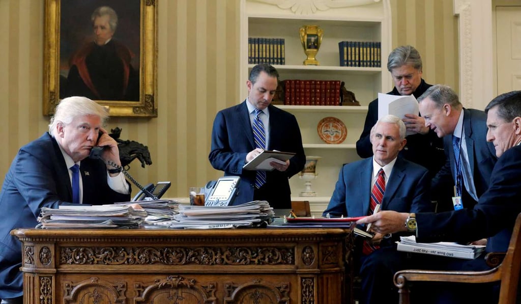 In this January 28 photo taken in the Oval Office of the White House, US President Donald Trump, joined by Chief of Staff Reince Priebus, Vice-President Mike Pence, senior adviser Steve Bannon, Communications Director Sean Spicer and then National Security Adviser Michael Flynn, speaks by phone with Russia's President Vladimir Putin. Photo: Reuters