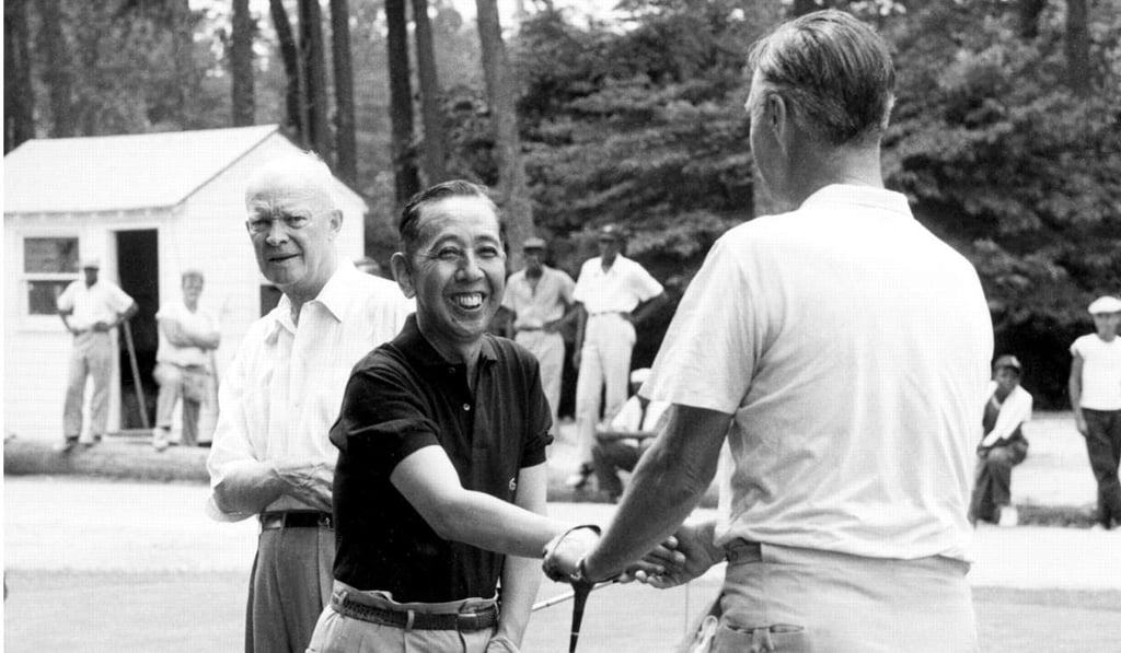 In this June 1957 photo, then Japanese prime minister Nobusuke Kishi shakes hands with then senator Prescott S. Bush, watched by then US president Dwight Eisenhower. Photo: AP