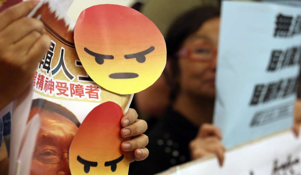 Pressure groups including the Alliance of Ex-mentally Ill of Hong Kong protest at the Equal Opportunities Commission against derogatory remarks made about the mentally ill by University of Science and Technology professor Francis Lui and columnist Chris Wat, last May 4. Photo: Nora Tam