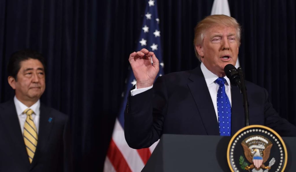 Japanese Prime Minister Shinzo Abe and US President Donald Trump speak at Trump's Mar-a-Lago resort in Palm Beach, Florida. Photo: AFP