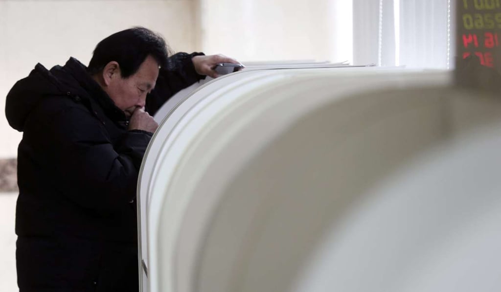 A Chinese investor uses computers to trade stocks at a securities brokerage house during the first trading day of the Chinese stock market. Photo: EPA A Chinese investor uses computers to trade stocks at a securities brokerage house during the first trading day of the Chinese stock market. Photo: EPA