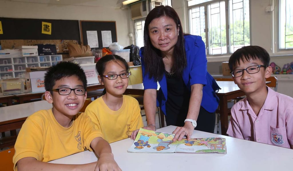School principal Jessie Cheung with some of her pupils. Photo: David Wong School principal Jessie Cheung with some of her pupils. Photo: David Wong