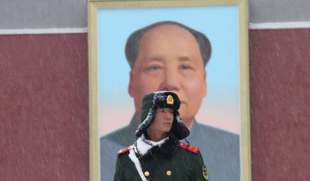 A soldier stands guard outside the Tiananmen gate in Beijing. Photo: Simon Song