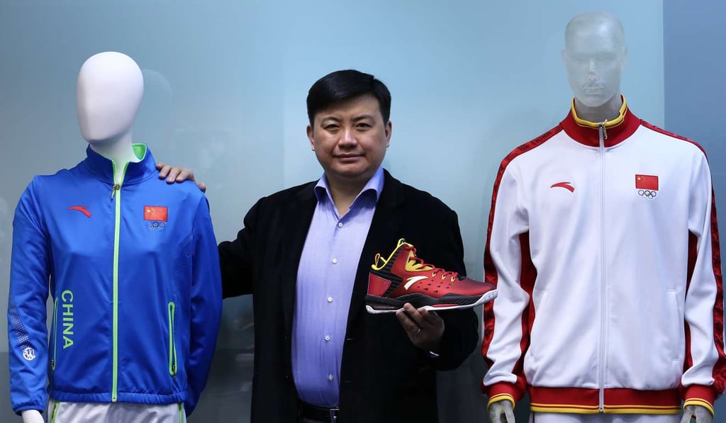 Anta Sports Products executive director James Zheng flanked by company products in a file photo from February 12, 2015.Photo: Jonathan Wong