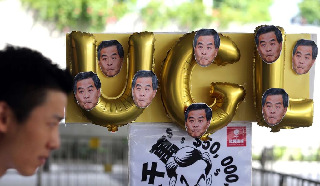 People protest outside the Legislative Council last July with regard to Leung Chun-ying’s HK$50 million deal with UGL. Photo: Sam Tsang