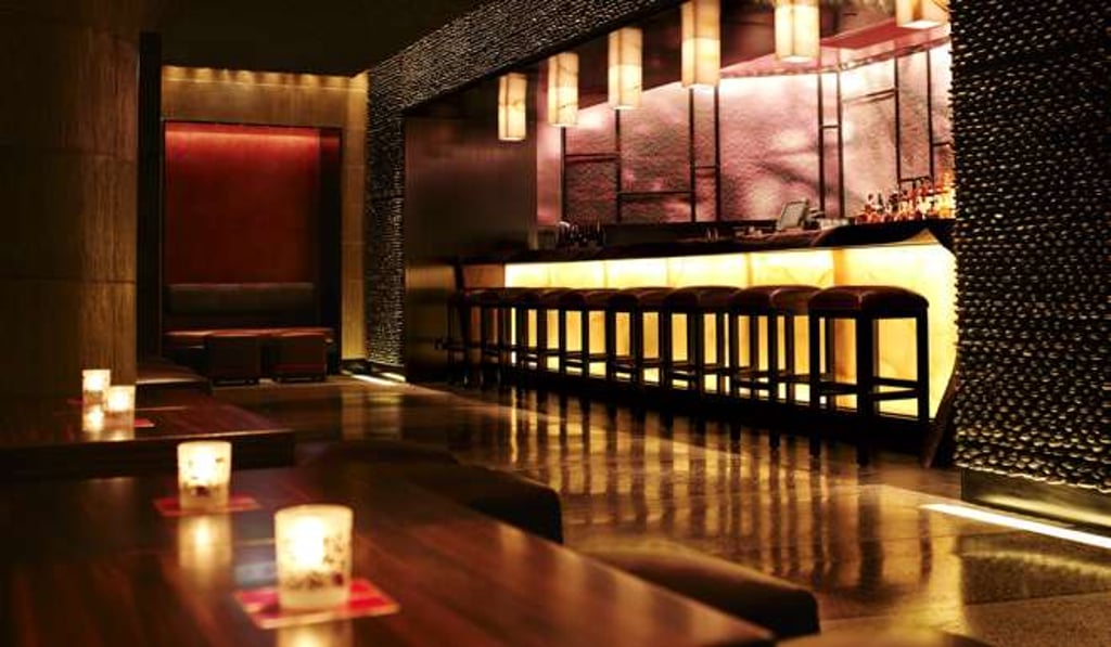 The interior of Nobu features natural elements such as wood, bamboo, rocks and glass.