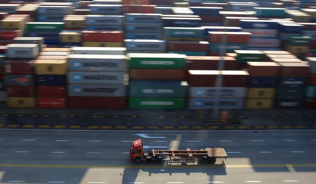 A truck drives past containers at the Yangshan Deep Water Port, within Shanghai’s pilot free trade zone. Hong Kong used to be the world’s busiest container port, but since 2005, its position has been eroded, overtaken by Shanghai and Singapore. Photo: Reuters