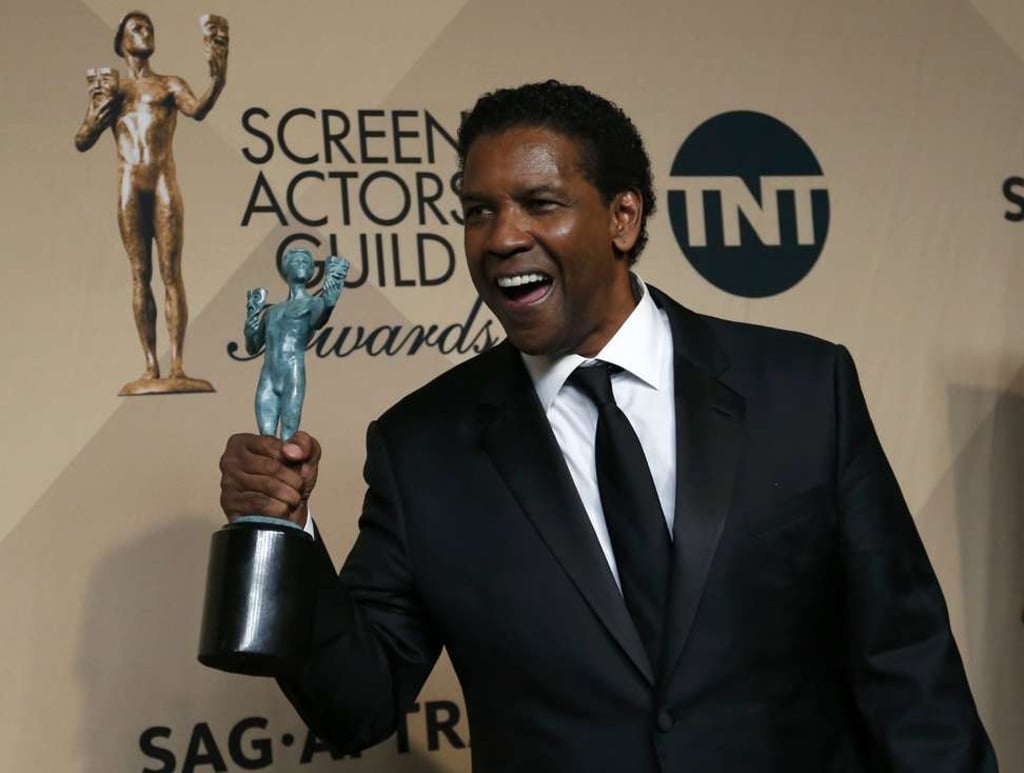 Denzel Washington with his best male lead actor at the Screen Actors Guild Awards in Los Angeles. Photo: Reuters