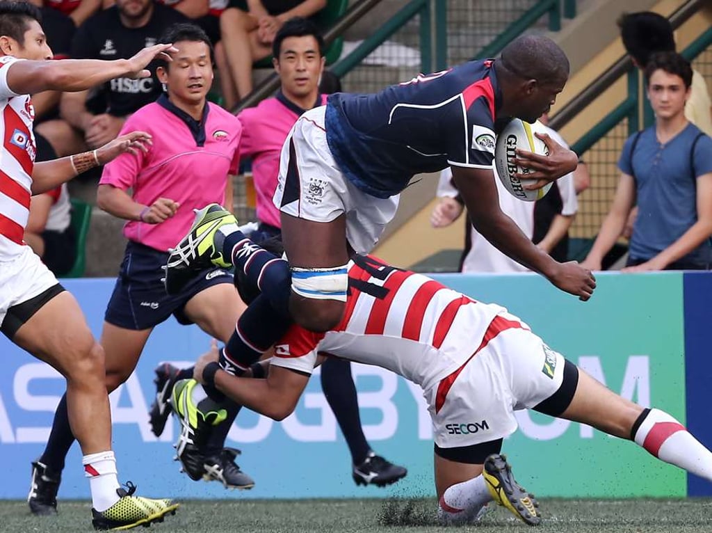 Imposing Hong Kong forward Adrian Griffiths takes on his Japan opponent in last year’s Asia Rugby Championship. Photo: Jonathan Wong