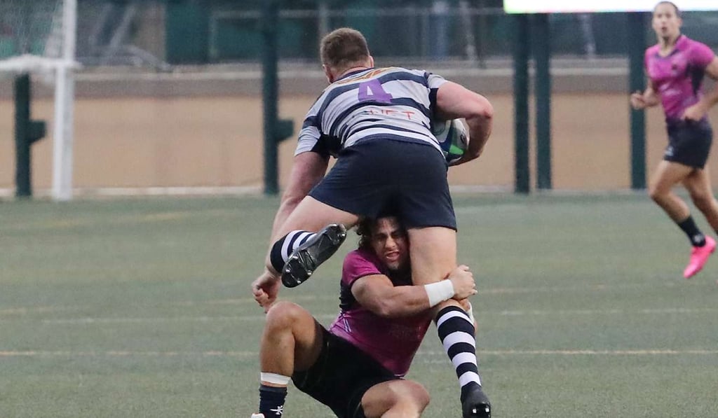 Hong Kong Football Club recruit Will Munro takes on the tackler in his side’s 17-3 quarter-final win over Cricket Club. Photo: Edward Wong