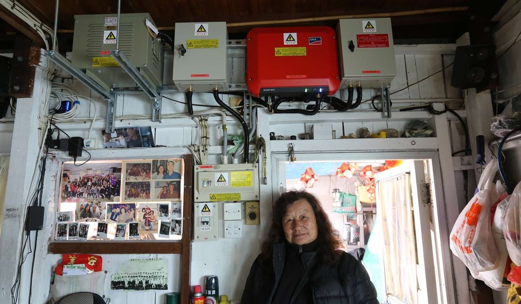 Tai O villager Fung Chuen-tai shows her solar power system. Photo: Dickson Lee
