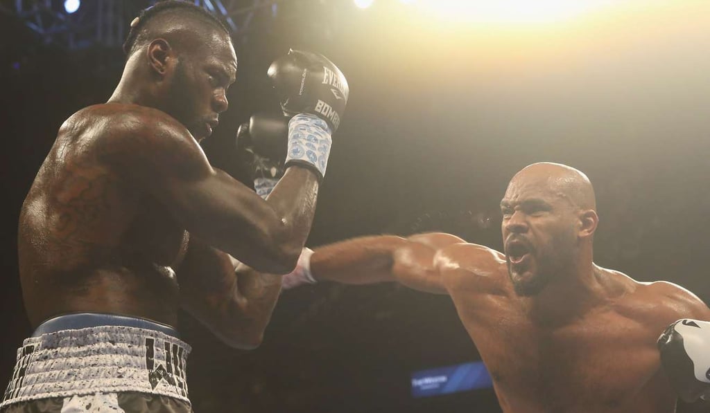 Deontay Wilder throws up his guard against Gerald Washington. Photo: AFP Deontay Wilder throws up his guard against Gerald Washington. Photo: AFP