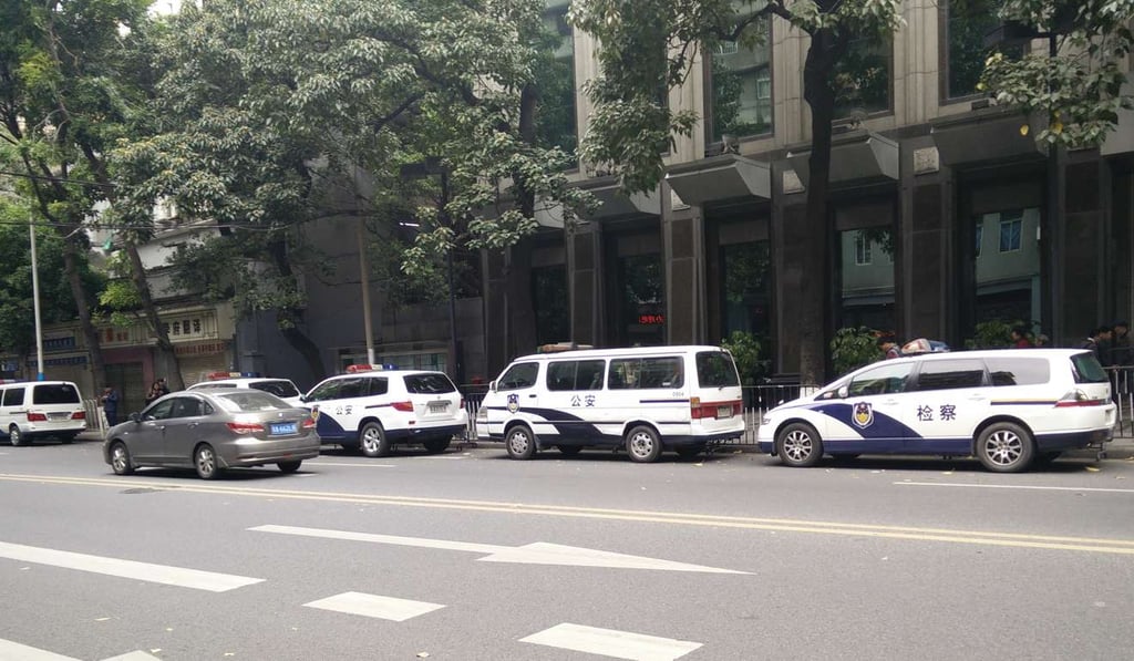 Police vehicles line up outside Guangzhou Intermediate People's Court on Monday. Photo: Handout Police vehicles line up outside Guangzhou Intermediate People's Court on Monday. Photo: Handout