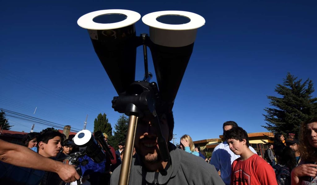 A man watching the eclipse in Coyhaique, Chile. Photo: Reuters