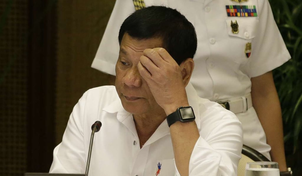 Philippine President Rodrigo Duterte looks at a computer monitor. Photo: AP Philippine President Rodrigo Duterte looks at a computer monitor. Photo: AP