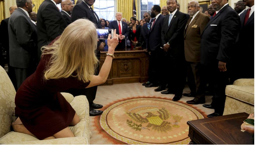 Counsellor to the President Kellyanne Conway takes a picture of US President Donald Trump with members of the Historically Black Colleges and Universities in the Oval Office of the White House. Photo: EPA