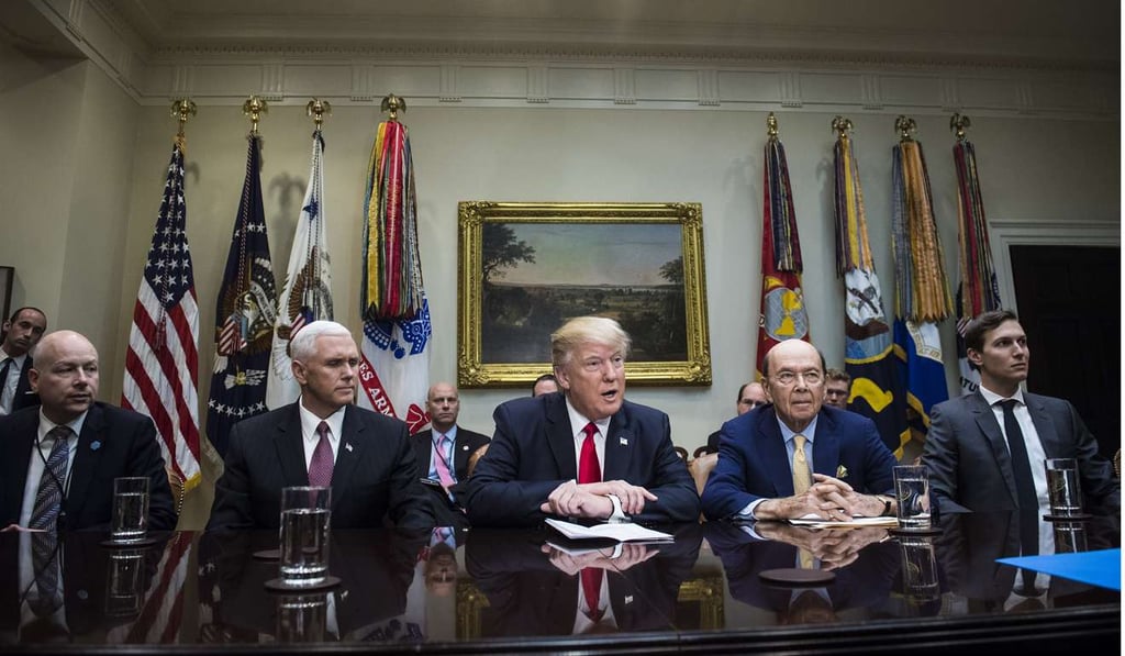 Vice President Pence, second from right, Commerce Secretary-designate Wilbur Ross, second from right, and White House senior adviser Jared Kushner, right, listen to President Donald Trump during a meeting with House and Senate legislators in the Roosevelt Room of the White House. Photo: Washington Post photo by Jabin Botsford