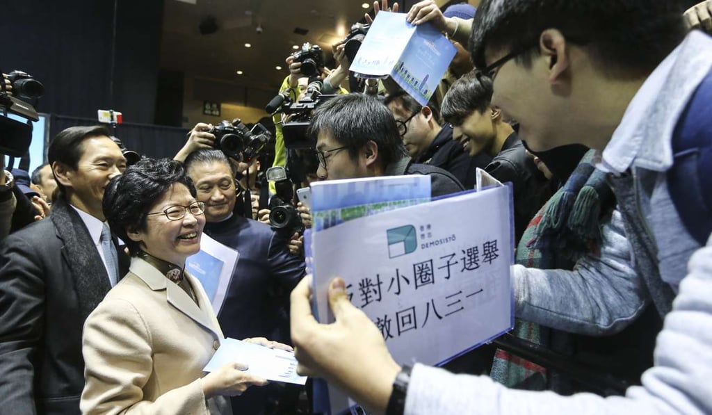 Carrie Lam faces protesters after unveiling her manifesto. Photo: Sam Tsang
