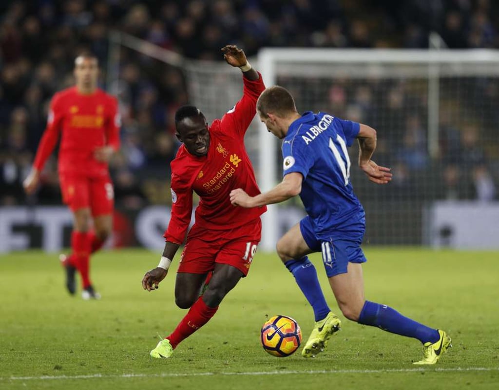 Leicester’s Marc Albrighton vies with Liverpool’s Sadio Mane. Photo: AFP