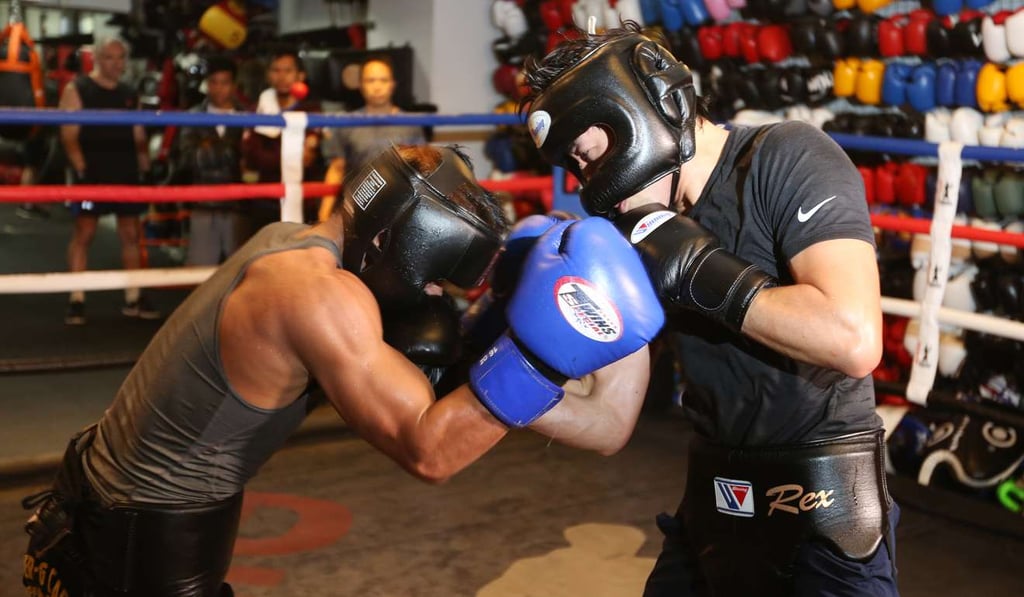 Rex Tso spars with Filipino boxer Mark Anthony Geraldo at DEF Boxing in Sheung Wan. Photo: Xiaomei Chen