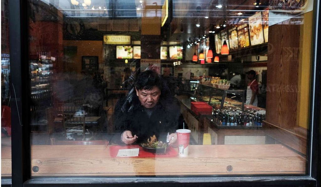 A man has a meal in a restaurant in New York. While globalisation has the potential to enrich the global economy, so far the richest have captured a hugely disproportionate share of the gains. Photo: AFP A man has a meal in a restaurant in New York. While globalisation has the potential to enrich the global economy, so far the richest have captured a hugely disproportionate share of the gains. Photo: AFP