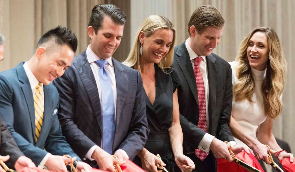 From left, Joo Kim Tiah, CEO of the Holborn Group, Donald Trump Jr, his wife Vanessa Haydon, Eric Trump, and his wife Lara Yunaska cut the ribbon during a ceremony for the Trump International Hotel and tower in Vancouver on Tuesday. Photo: AFP