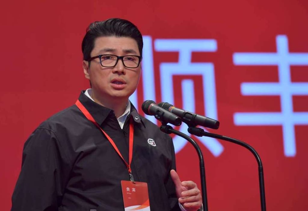 Last Friday, wearing a black outfit with his company’s logo, a pair of blue jeans, and running shoes, chairman Wang Wei rang the bell for the start of trading in SF shares – the company he founded in 1993 doing parcel delivery with six men and a van. Photo: Imaginechina