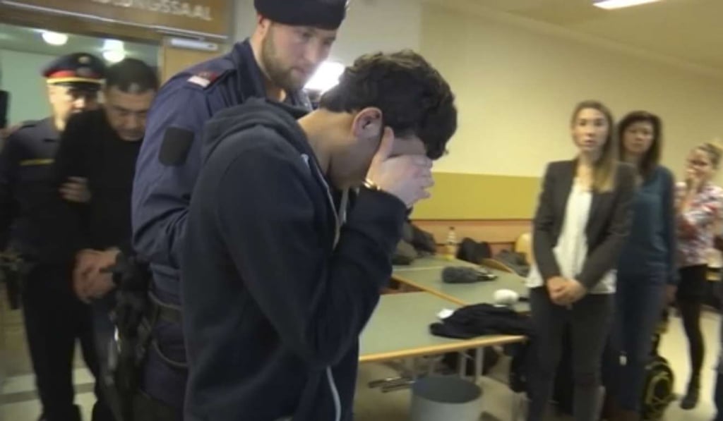 A defendant covers his face as he is lead out of the court room after his trial on gang-raping a German tourist in Vienna. Photo: AP A defendant covers his face as he is lead out of the court room after his trial on gang-raping a German tourist in Vienna. Photo: AP