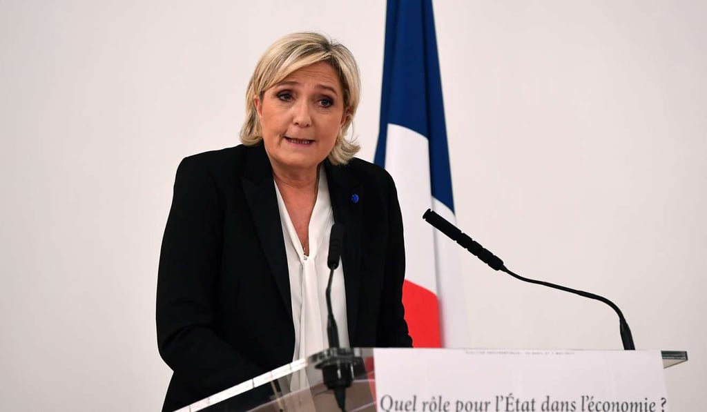 French far-right Front National (FN) party candidate for the presidential election Marine Le Pen delivers a speech on stage during a press conference on the theme French far-right Front National (FN) party candidate for the presidential election Marine Le Pen delivers a speech on stage during a press conference on the theme
