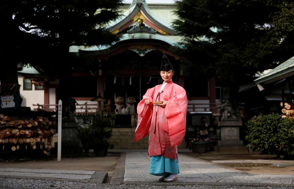 Shinto priest Tomoe Ichino, 40, poses for a photograph at the Imado Shrine in Tokyo, as part of a series of photos on working women by Reuters, ahead of International Women’s Day on March 8. Photo: Reuters