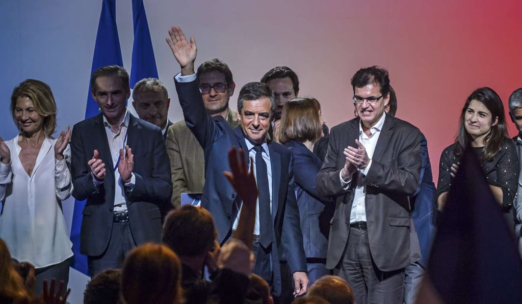 Les Republicans party candidate for 2017 presidential election, Francois Fillon waves after delivering a speech during a campaign event in Aubervilliers, near Paris. Photo: EPA