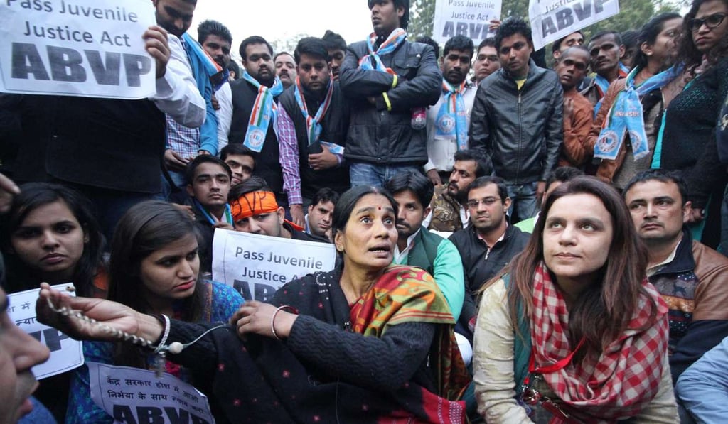 The mother (centre) of a murdered gang rape victim takes part in a rally protesting the release of the youngest of six men found guilty of the crime, in New Delhi, India, in December 2015.Photo: EPA