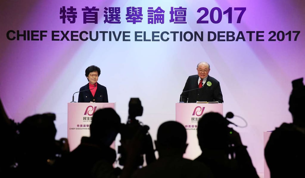 Chief Executive candidates Carrie Lam Cheng Yuet-ngor (Left) and Woo Kwok-hing (Right) attend the Path of Democracy's chief executive election Debate at Pui Ching Primary School in Yau Ma Tei last week. Felix Wong