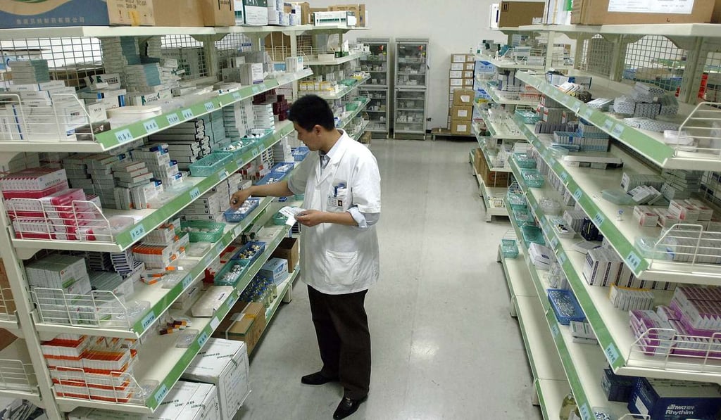 A pharmacist checks his stock at a hospital pharmacy in Hefei, central China's Anhui province. Photo: AFP