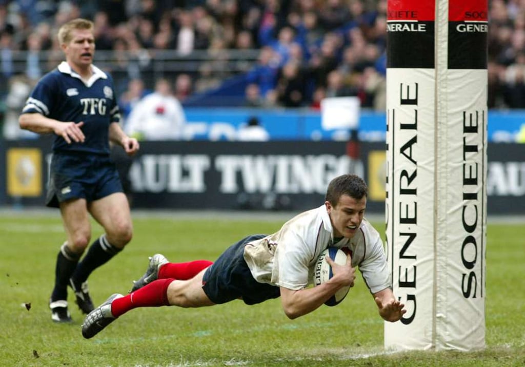 France's Damien Traille scores a try against Scotland during the 2003 Six Nations. Photo: AP