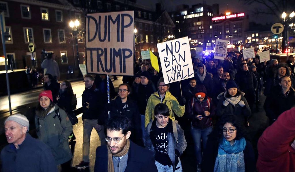 Hundreds of protesters march against the revised US travel ban, in Cambridge, Massachusetts, on March 7. President Donald Trump’s revised order blocks people from six Muslim-majority nations from obtaining US visas for at least 90 days, and suspends the refugee resettlement process for 120 days. Photo: AP Hundreds of protesters march against the revised US travel ban, in Cambridge, Massachusetts, on March 7. President Donald Trump’s revised order blocks people from six Muslim-majority nations from obtaining US visas for at least 90 days, and suspends the refugee resettlement process for 120 days. Photo: AP