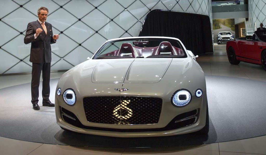 Wolfgang Duerheiner, Chairman and Chief Executive of Bentley Motors presents the new Bentley Exp12 during the 87th Geneva International Motor Show. Photo: AP
