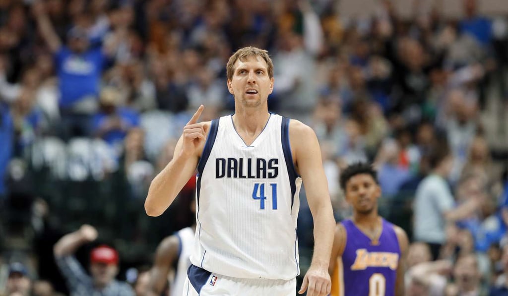 Dallas Mavericks forward Dirk Nowitzki celebrates sinking a three-pointer. Photo: AP