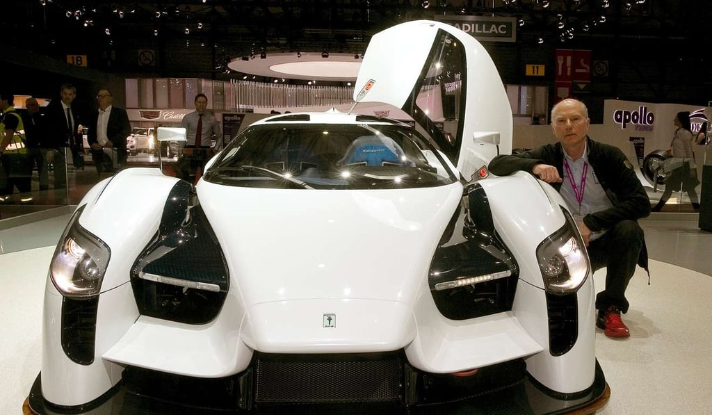 American Ferrari collector Jim Glickenhaus beside a 800 horsepower SCG 0003S racecar at the 87th International Motor Show. Photo: REUTERS